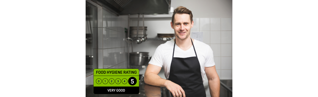 Chef preparing for a food hygiene inspection in a commercial kitchen